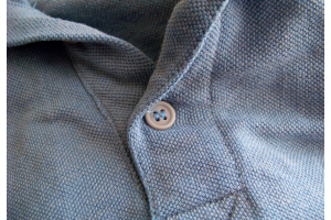 Close up of a grey pique polo 