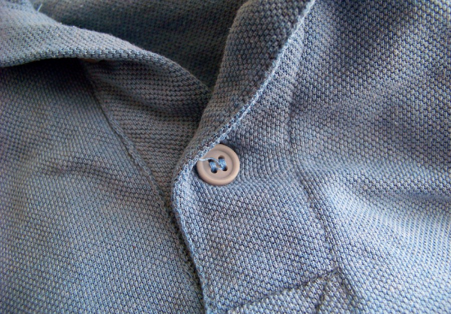 Close up of a grey pique polo 