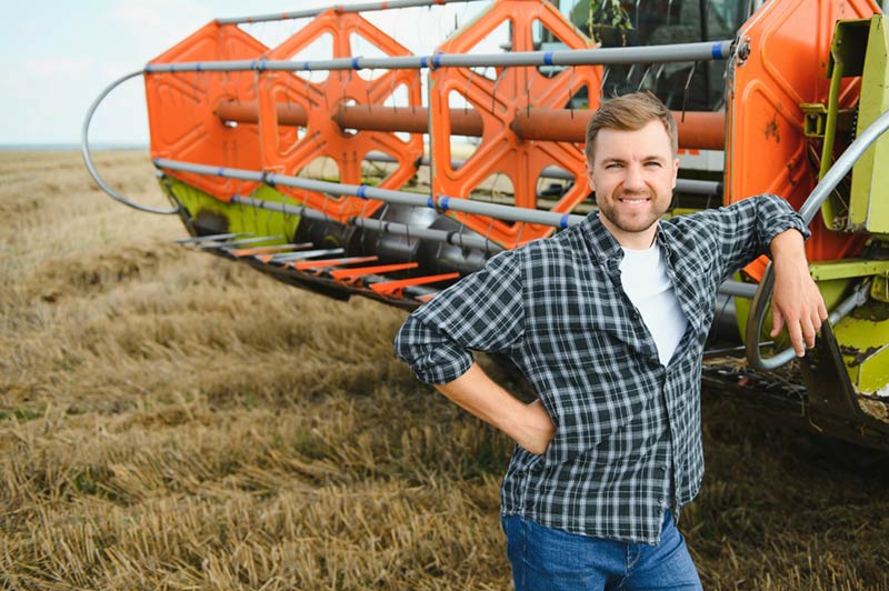 A farmer dressed in a men’s flannel work shirt